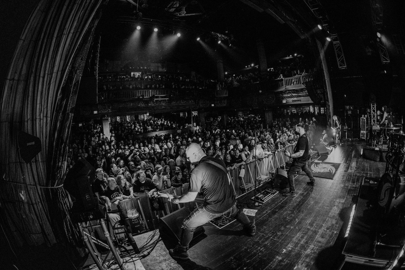 A packed theatre seen from the stage on the Nita Strauss tour, Dean at the barricade