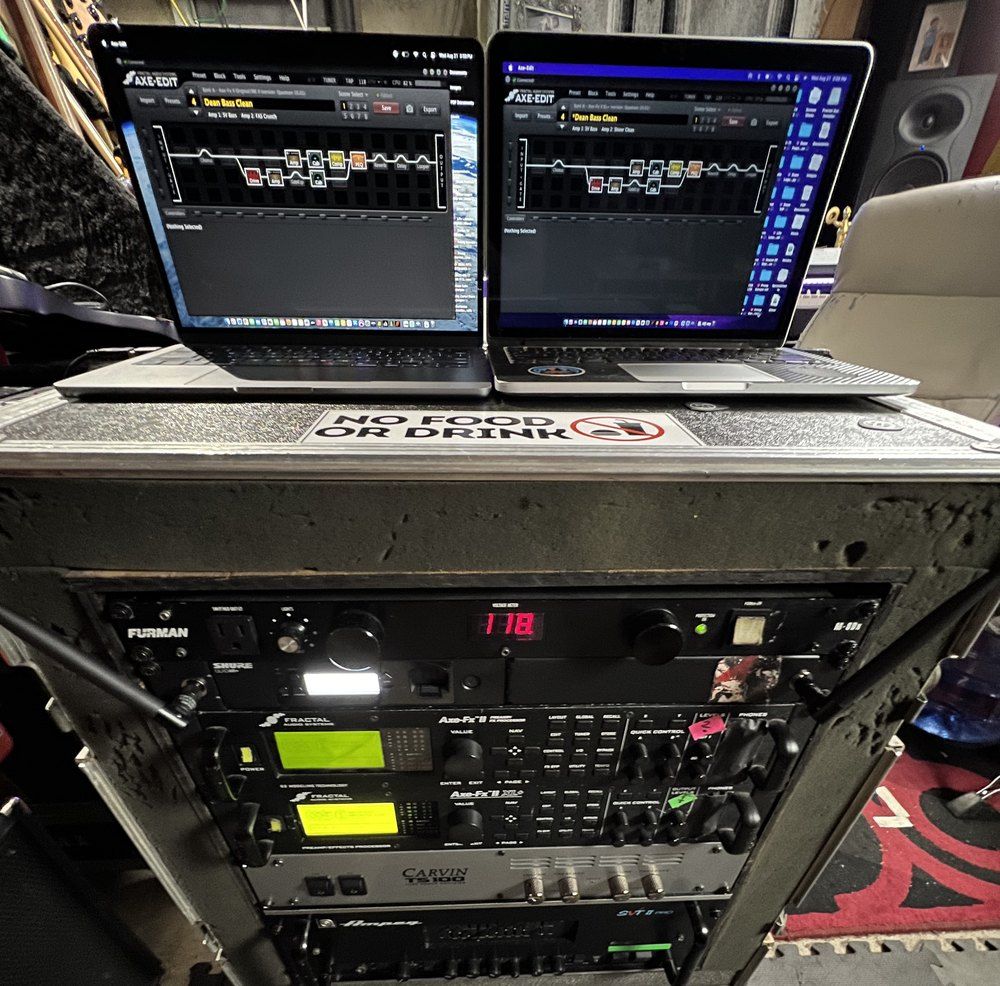 Axe-Edit open on two laptops on top of the touring rack, showing the preset Dean Bass Clean