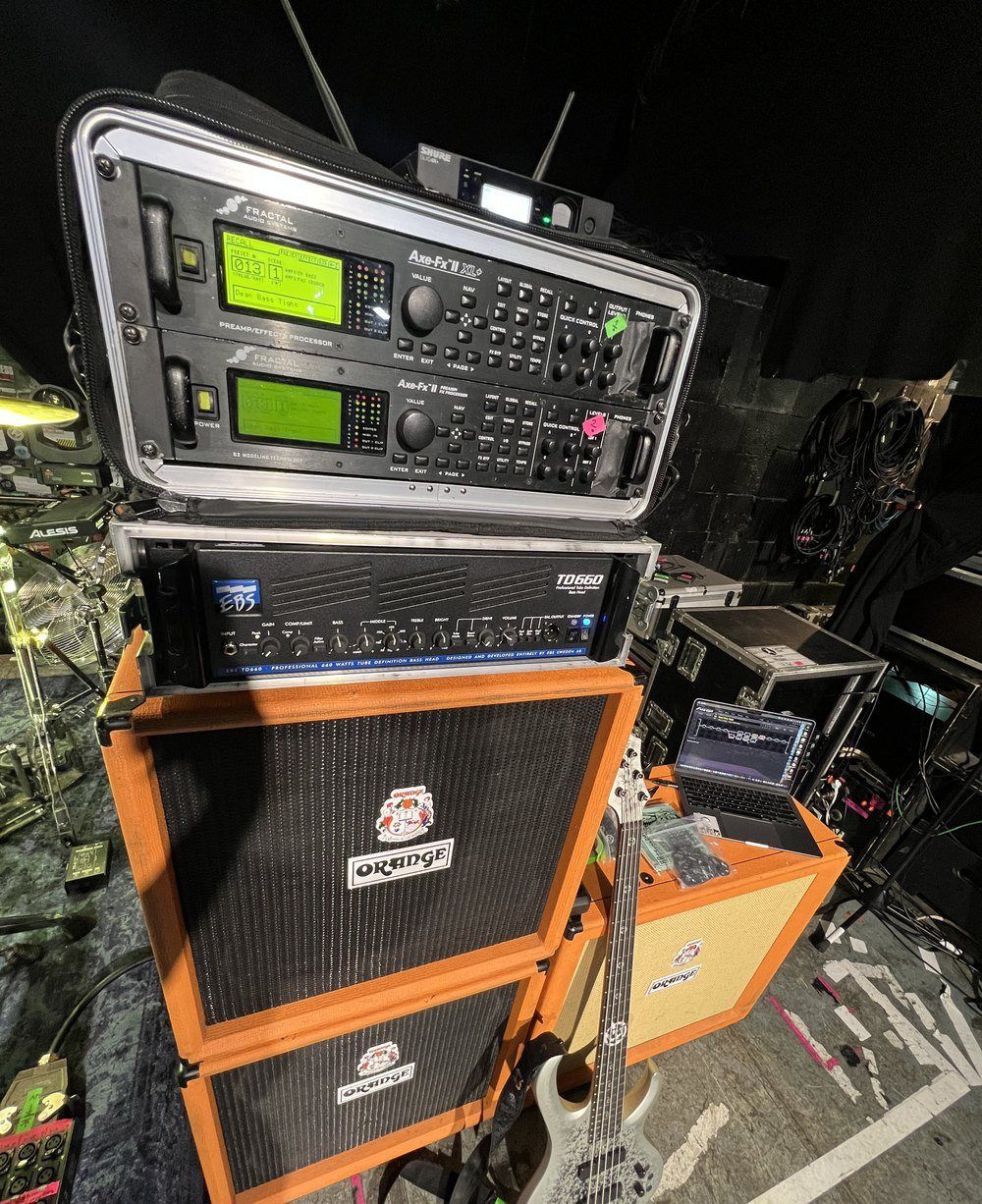 Fractal Axe-Fx II and EBS TD650 power amp in a flight case rack backstage, Shure GLXD wireless on top